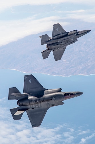 A pair of F-35s soar over the Pacific Ocean range near NAWS Point Mugu during a recent Weapons Delivery Accuracy testing surge. (Photo by Darrin Russel/Lockheed Martin)