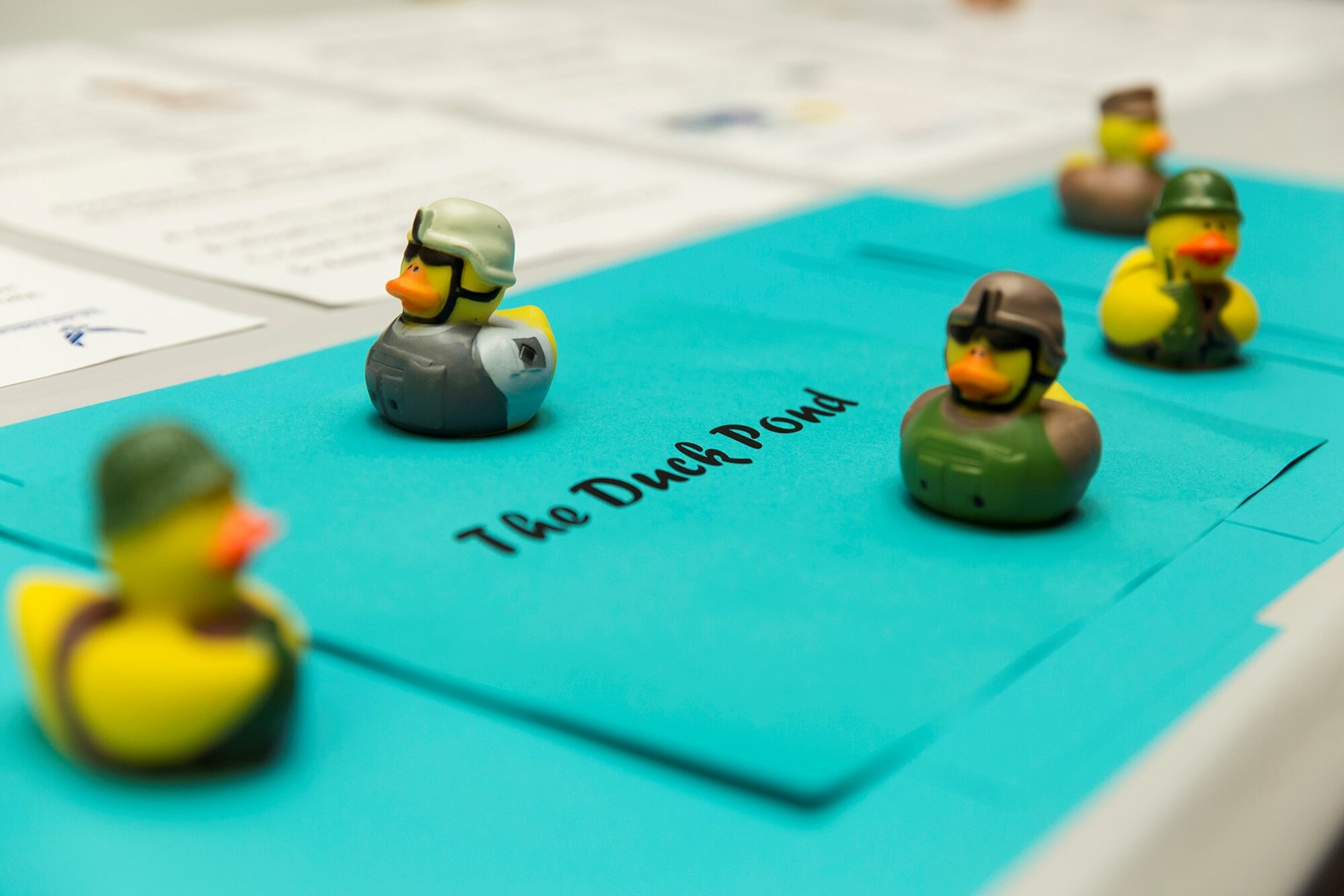 Military rubber ducks, part of the Defense Language Institute safety campaign, are displayed for viewing during an award ceremony at Joint Base San Antonio-Lackland, Texas Aug. 4, 2017. The ducks were used as a trophy system for the ten-week safety camping that DLI held.