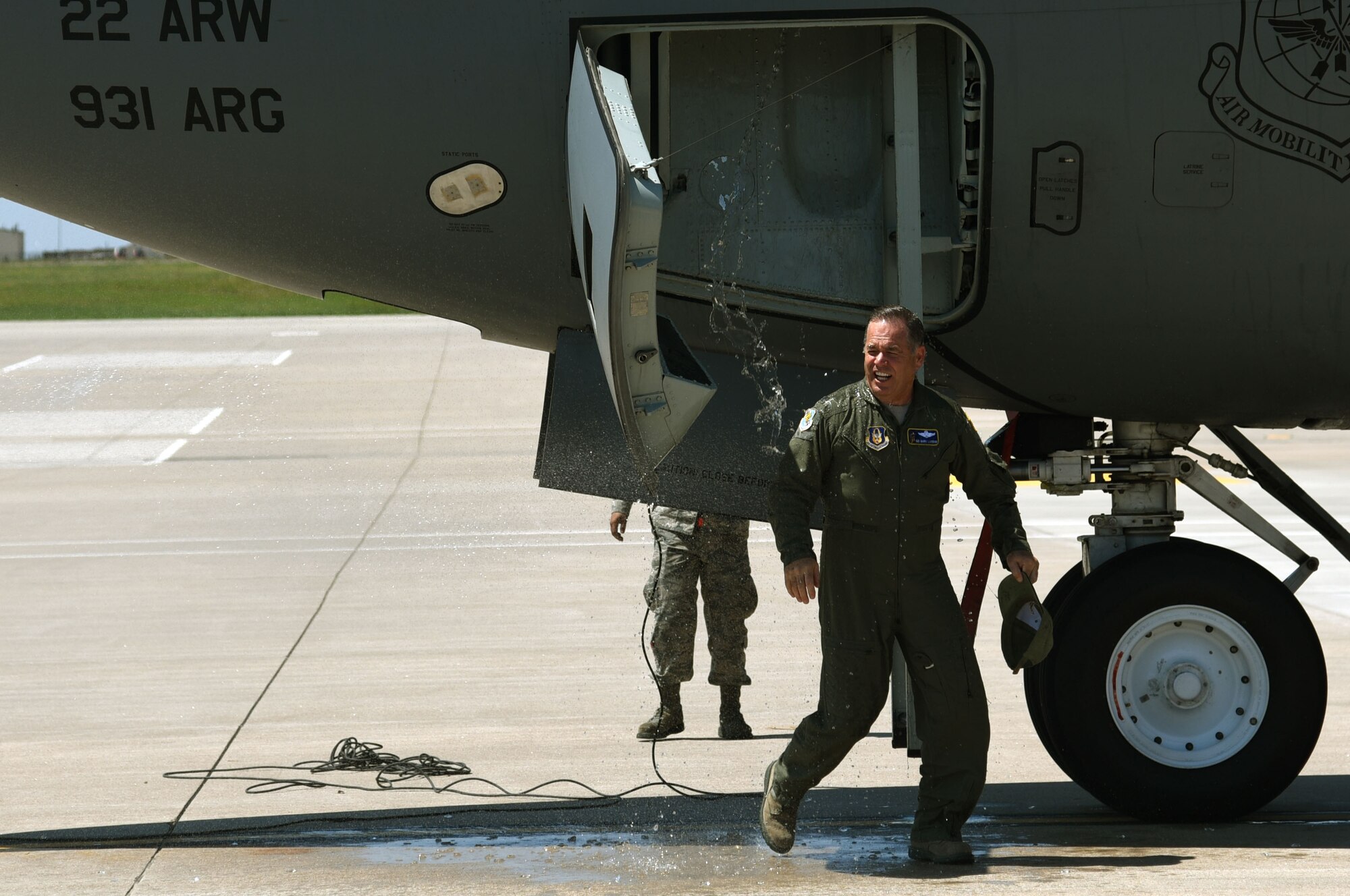Col. Mark S. Larson, 931st Air Refueling Wing commander, steps off a KC-135 Stratotanker after his fini-flight, Aug. 17, 2017, at McConnell Air Force Base, Kan. Fini-flights are the last flight a pilot has before retirement or before a commander is assigned elsewhere.