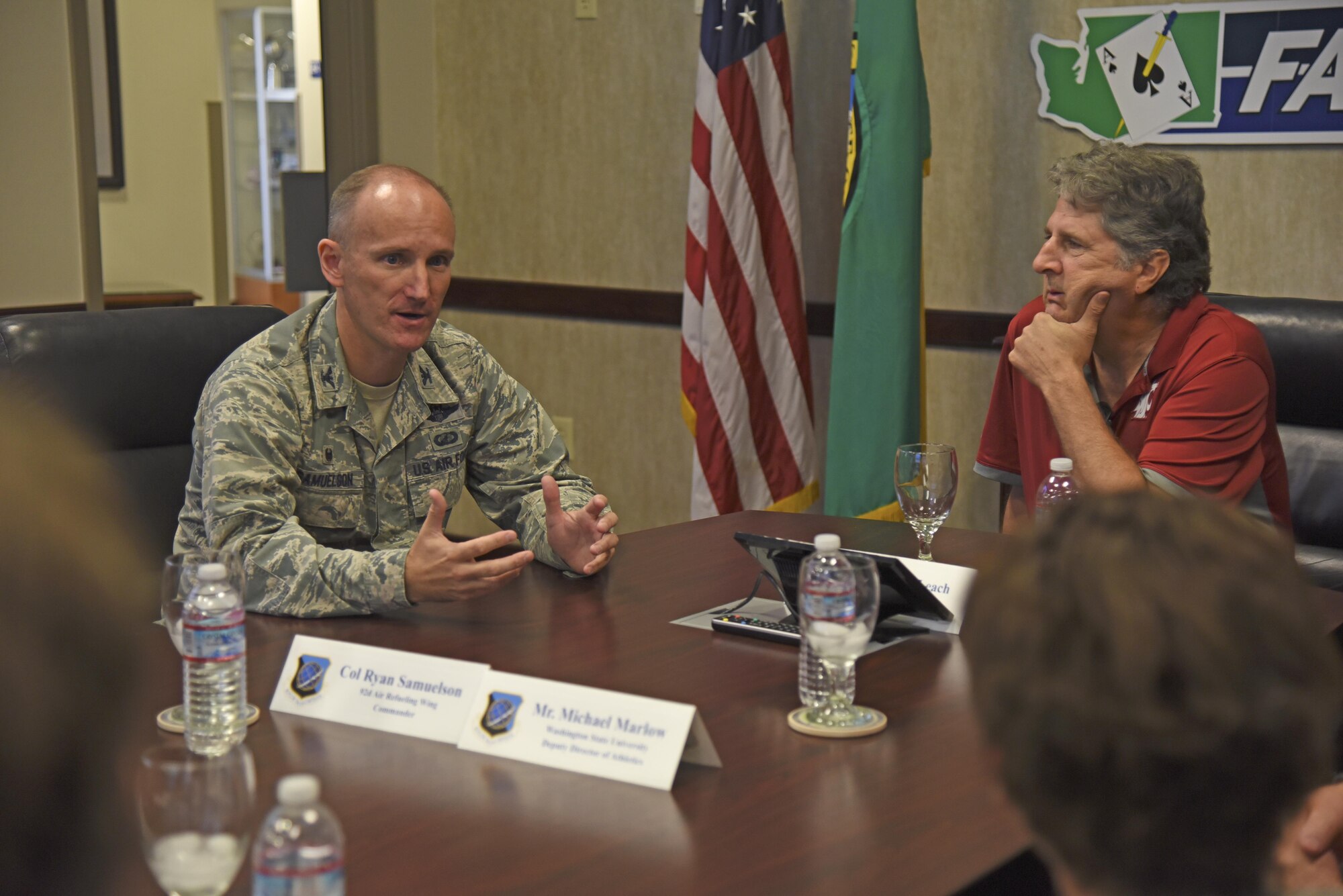 Col. Ryan Samuelson, 92nd Air Refueling Wing commander provides Mike Leach, Washington State University head football coach, a mission briefing during his visit Aug. 15, 2017, at Fairchild Air Force Base, Washington. Leach’s father, Frank, served in the Air Force during the Korean War. He was stationed at Deep Creek, one of four storage facilities near present-day Fairchild used for Nike missiles during the 1950s and 1960s. (U.S. Air Force photo/Senior Airman Mackenzie Richardson)