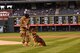 Senior Airman Rafael Del Real, 90th Security Forces Squadron military working dog handler, F.E. Warren Air Force Base, Wyo., prepares to throw the first pitch at the Colorado Rockies vs. Atlanta Braves baseball game in Denver Colo., Aug. 16, 2017. Del Real has been a military working dog handler for three months. (U.S. Air Force Photo by Airman 1st class Braydon Williams)