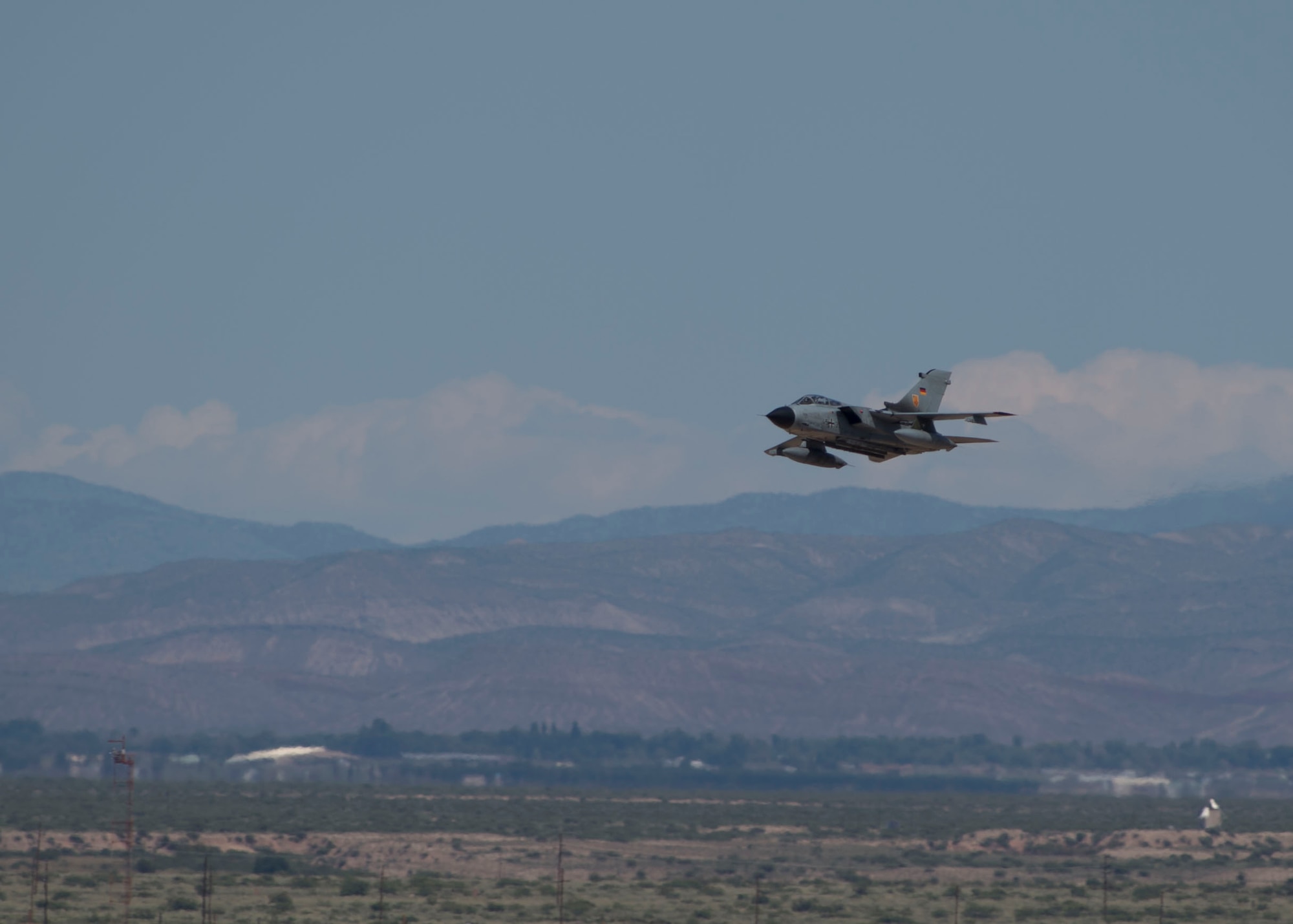 A German air force Tornado aircraft prepares to land following its last flying mission with an F-16 Fighting Falcon here at Holloman Air Force Base, N.M., Aug. 17, 2017. The German air force has entered its final stage of departure, however they will not complete their departure from Holloman AFB until mid 2019. (U.S. Air Force photo by Senior Airman Chase Cannon)