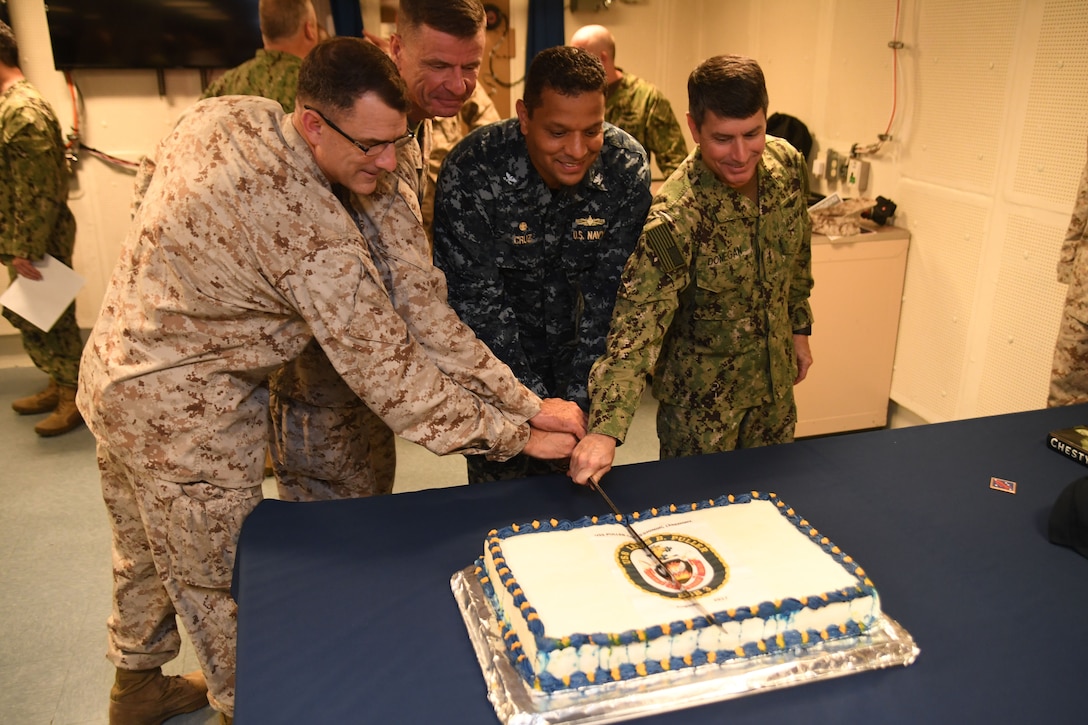 170817-N-TB177-0440 MANAMA, Bahrain (August 17, 2017) From the right, Vice Adm. Kevin Donegan, Capt. Adan G. Cruz, Lt. Gen. Dave Beydler, and Brig. Gen. Francis Donovan cut a cake after the commissioning ceremony for the USS Lewis B. Puller (ESB 3). Puller is the first U.S ship to be commissioned outside the United States, and the ship's reclassification provides U.S. Central Command and 5th Fleet greater flexibility to better meet regional challenges. (U.S. Navy photo by Mass Communication Specialist 2nd Class Kevin Steinberg)