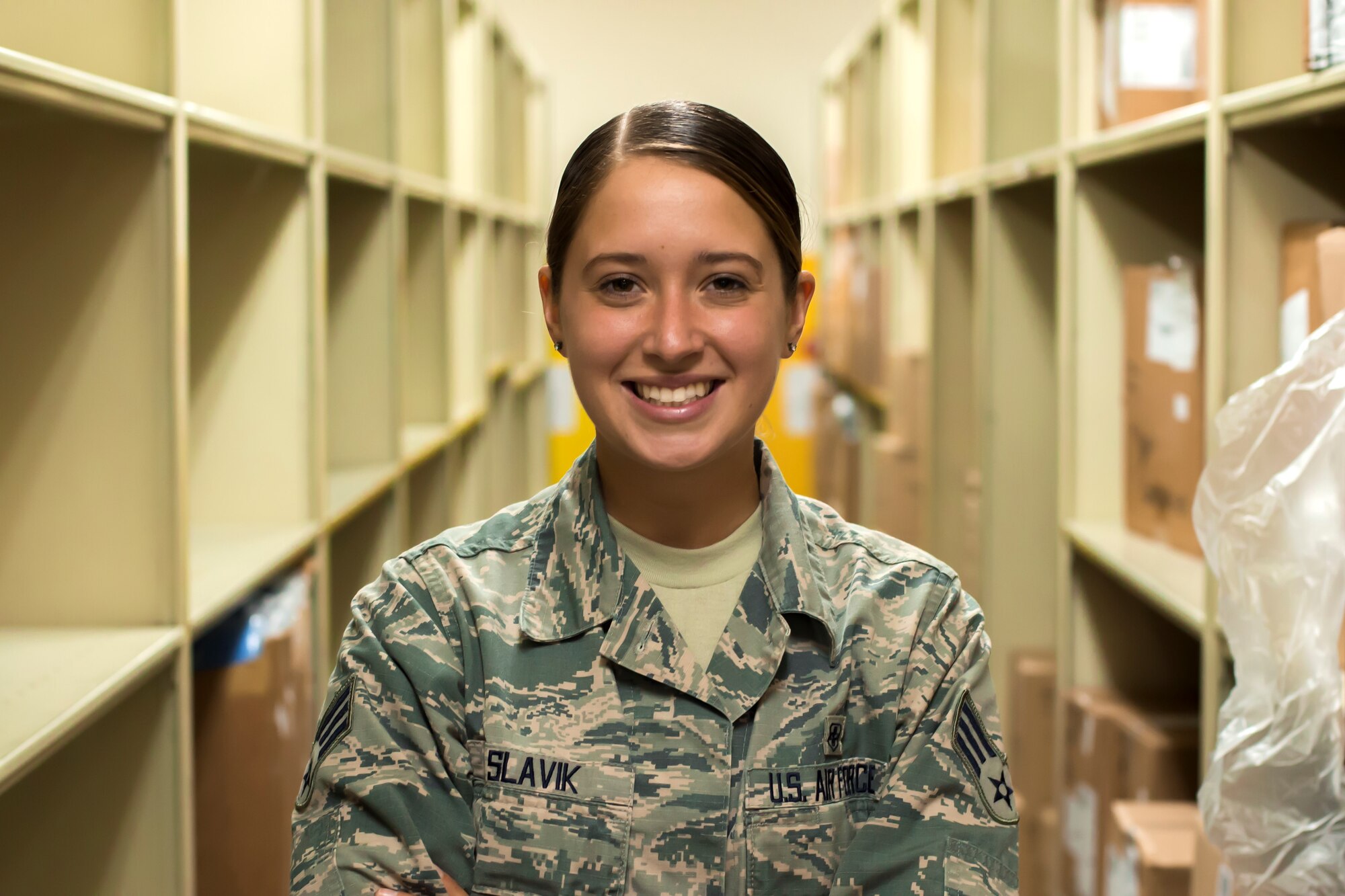 Senior Airman Amber Slavik poses for a photo in the medical group expansion bay at Misawa Air Base, Japan.