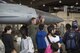 U.S. Air Force Maj. Richard Smeeding, the Pacific Air Forces F-16 Demonstration Team pilot, educates children from the Hirosaki Aiseien Orphanage during a tour at Misawa Air Base, Japan, Aug. 11, 2017. The children had the rare opportunity to meet with Air Force, Navy, Army and Marine personnel. The volunteers engaged with the children and watched a munitions load competition, before getting an up close and personal tour of the F-16 Fighting Falcon. (U.S. Air Force photo by Staff Sgt. Melanie A. Hutto)