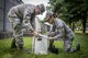 Senior Airman Marvin Varela, and Airman 1st Class Victoria Velazquez, 374th Public Health technicians, prepare a mosquito trap, Aug. 7, 2017, at Yokota Air Base, Japan. The trap lures mosquitos with a scented bait and uses a fan to suck them into the main chamber. (U.S. Air Force photo by Airman 1st Class Donald Hudson)