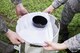 Senior Airman Marvin Varela, and Airman 1st Class Victoria Velazquez, 374th Public Health technicians, prepare a mosquito trap, Aug. 7, 2017, at Yokota Air Base, Japan. The trap lures mosquitos with a scented bait and uses a fan to suck them into the main chamber. (U.S. Air Force photo by Airman 1st Class Donald Hudson)