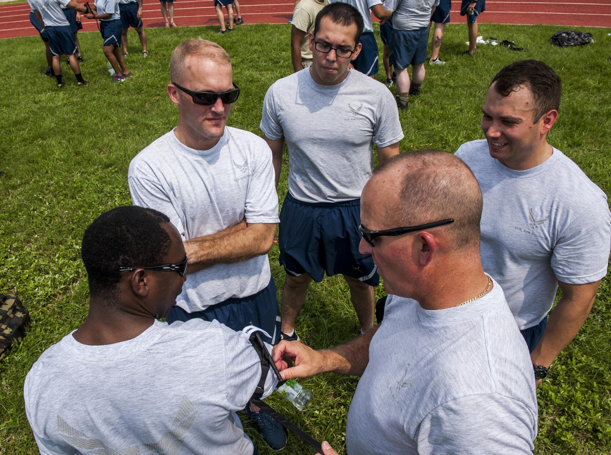 U.S. Air Force Airmen assigned to the 8th Fighter Wing, practice using and applying a tourniquet during a wing training day at Kunsan Air Base, Republic of Korea, Aug. 18, 2017. The day focused on Ability To Survive and Operate training and tested Airmen with various emergency situations including chemical attacks, unexploded ordnance and self-aid buddy care. (U.S. Air Force photo by Senior Airman Colville McFee)