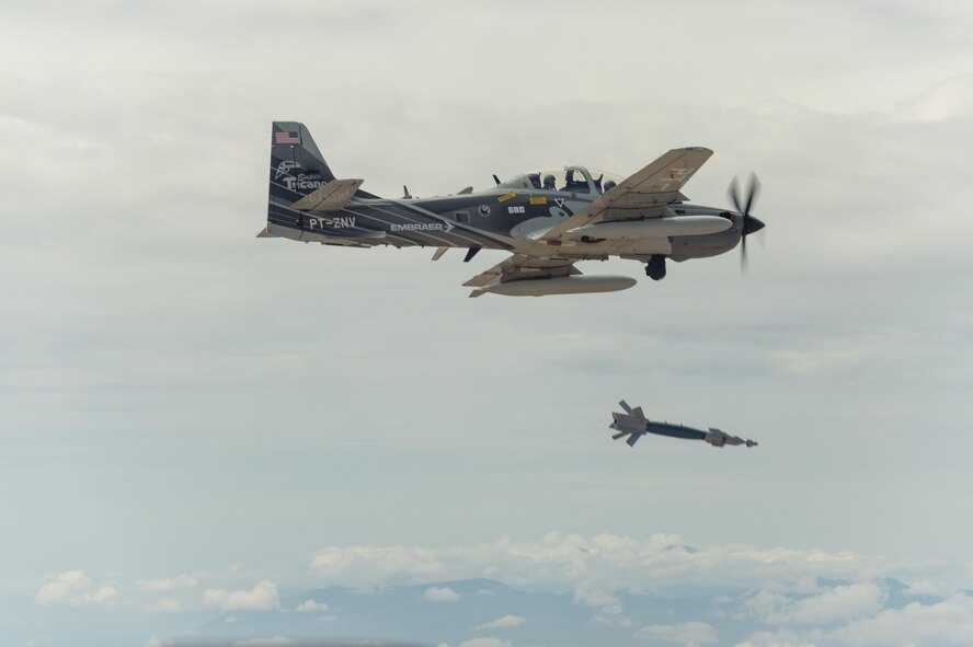 An Embraer EMB 314 Super Tucano A-29 experimental aircraft flies over White Sands Missile Range. The A-29 is participating in the U.S. Air Force Light Attack Experiment, a series of trials to determine the feasibility of using light aircraft in attack roles. (U.S. Air Force photo/Ethan D. Wagner)