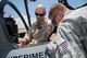 HOLLOMAN AIR FORCE BASE, N.M. – Flight test pilot Stu Rogerson descibes emergency shutdown procedures for the Textron Scorpion experimental aircraft to fire response personnel at Holloman AFB. The Scorpion is participating in the U.S. Air Force Light Attack Experiment (OA-X), a series of trials to determine the feasibility of using light aircraft in attack roles. (U.S. Air Force photo/ Christopher Okula)