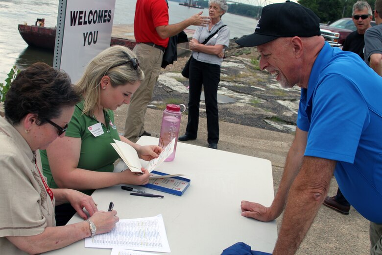 Susan Pippin, left, Amy Snively, center, sign in John Holm, Kansas City District chief of Civil Branch, Project Management August 16, 2017.