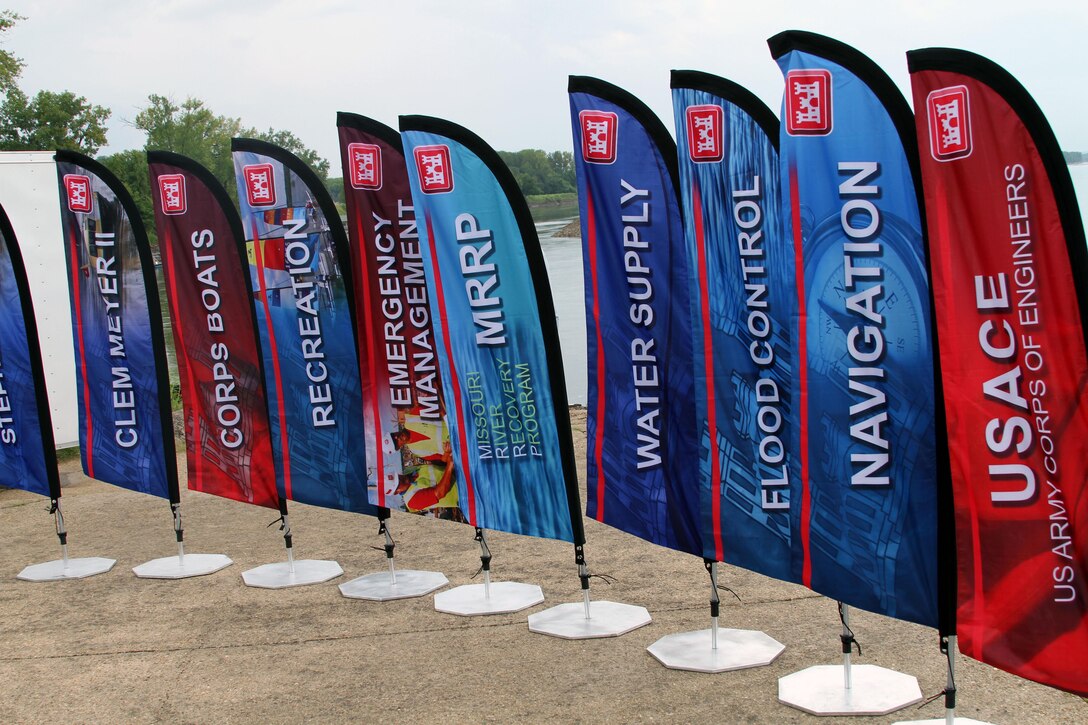 Flags show the many missions of the Corps of Engineers near the dock for the 2017 Barge Tour in Washington, Mo., 16 August.