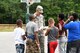 Senior Airman Brody Beaver, 178th Wing, Springfield Ohio Air National Guard, presents children from his group a small gift and note of encouragement at Camp Sunrise, Clarksville, Ohio as part of a military appreciation event there August 10.
The camp is the only camp in Ohio for children effected by HIV/AIDS. (U.S. Air National Guard photo by Senior Master Sgt. Joseph Stahl)