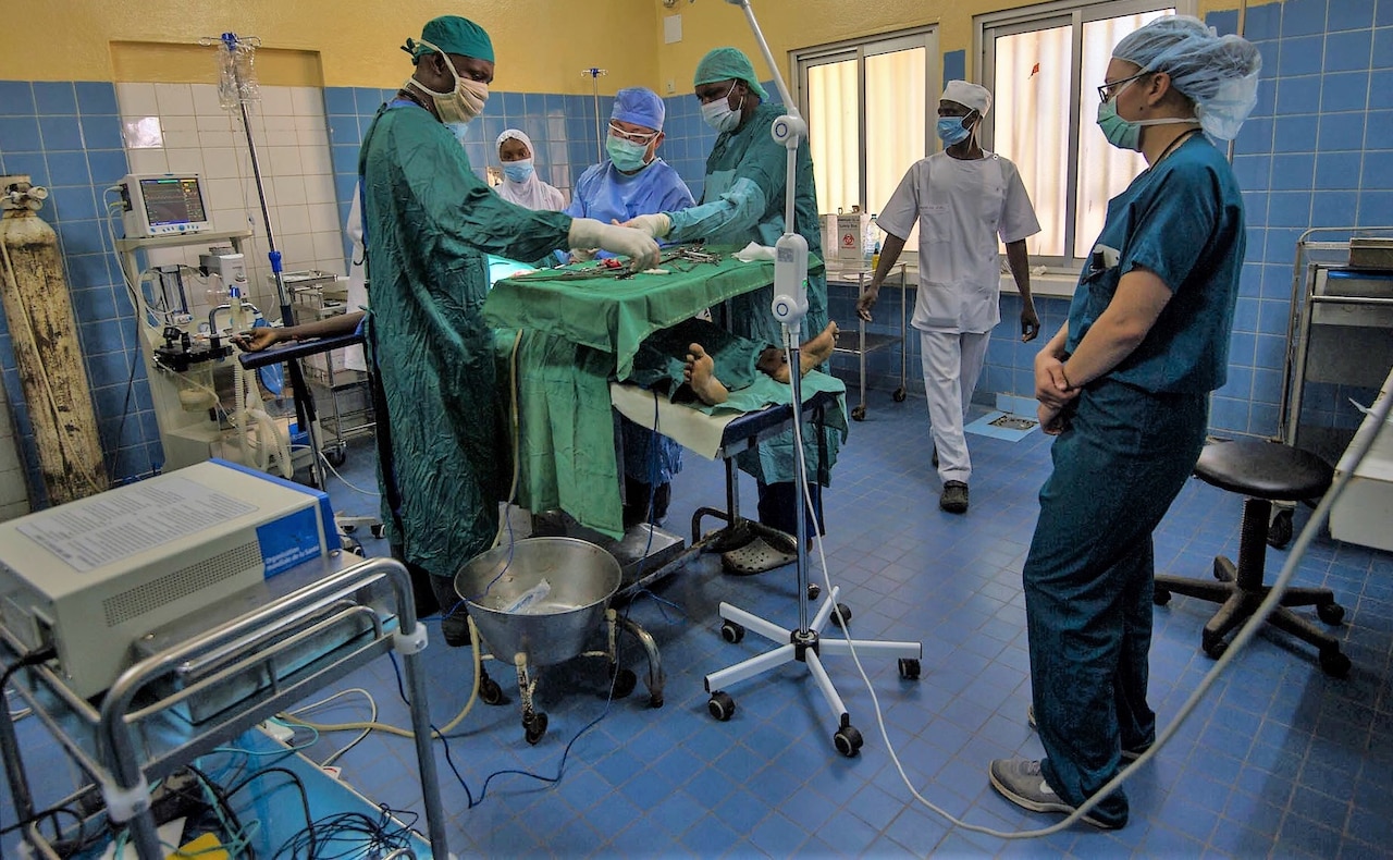 Surgeons working in operating room.