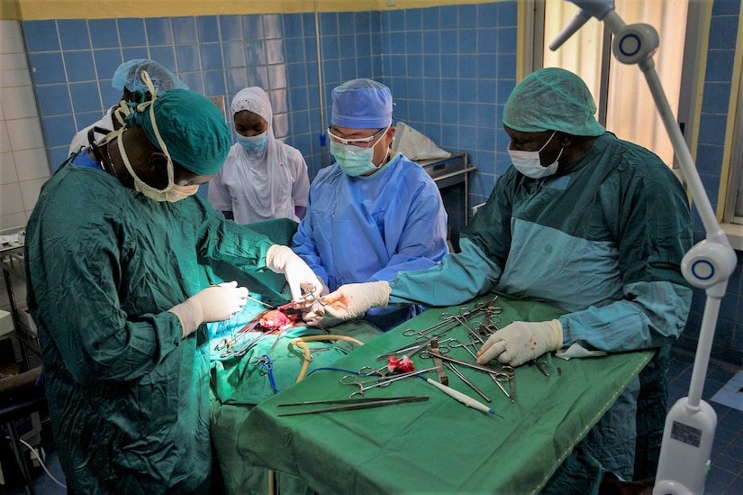 Surgeons working in an operating room.