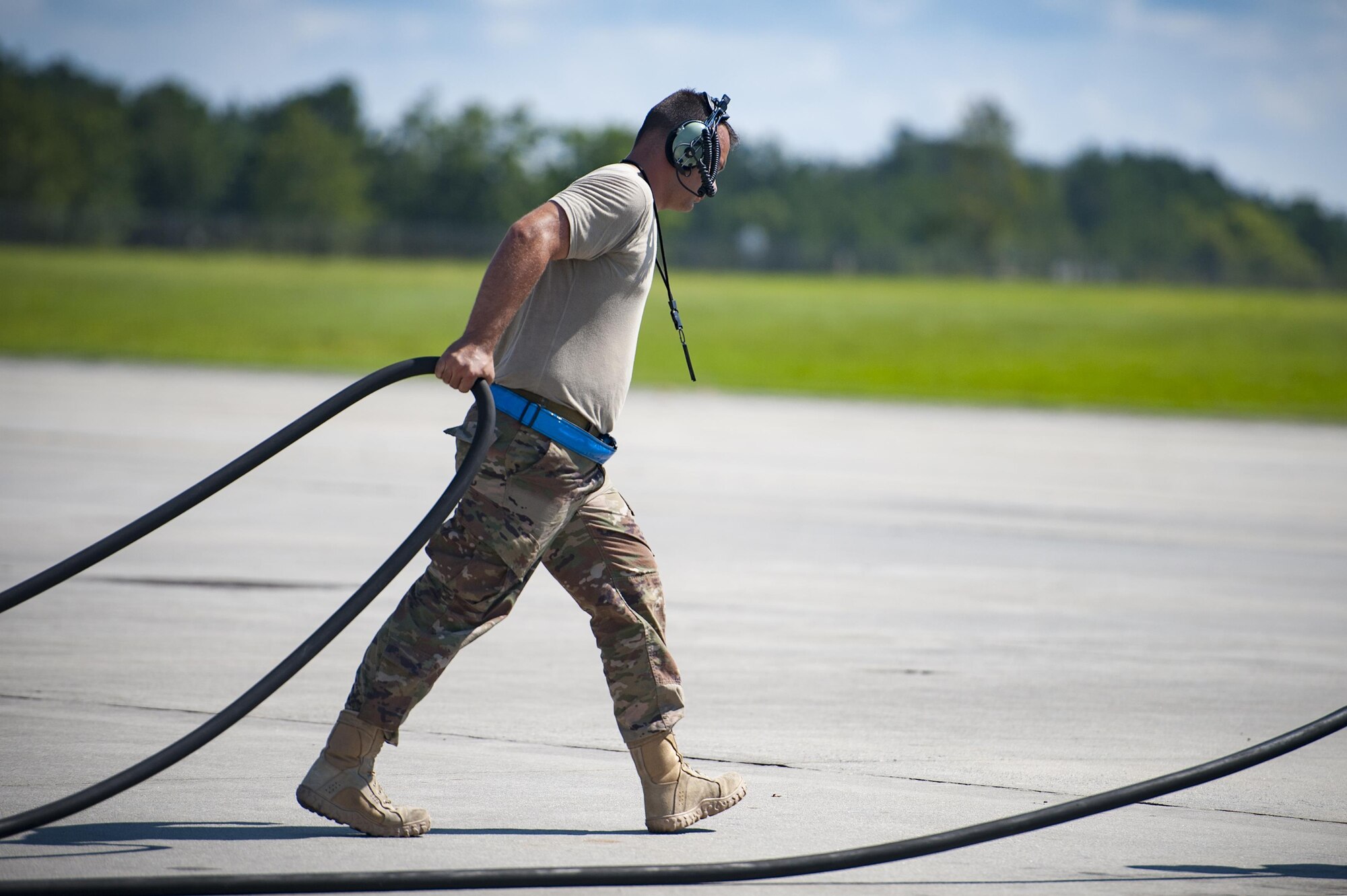 An Airman from the 71st Rescue Squadron Aircraft Maintenance Unit pulls a power cord prior to launching an HC-130J Combat King II, Aug. 17, 2017, at Moody Air Force Base, Ga. Maintainers perform various tasks prior to take-off such as pre-flight inspections, removing plugs and covers, repairing any problems found during crew pre-flight checks and marshalling the aircraft. (U.S. Air Force photo by Airman 1st Class Lauren M. Sprunk)