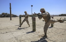 Recruits from Charlie Company, 1st Recruit Training Battalion, step over wires during the Bayonet Assault Course at Marine Corps Recruit Depot San Diego, Aug. 8.