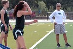 Runners of the Cole High School cross country team work out under the direction of coach Tina Guerrero (right) on the new turf at the newly renovated Cole stadium Aug. 2.  Besides the new turf, a $7.3 million renovation of the stadium added new lights, a new press box, new restrooms, a new scoreboard and new concession area.