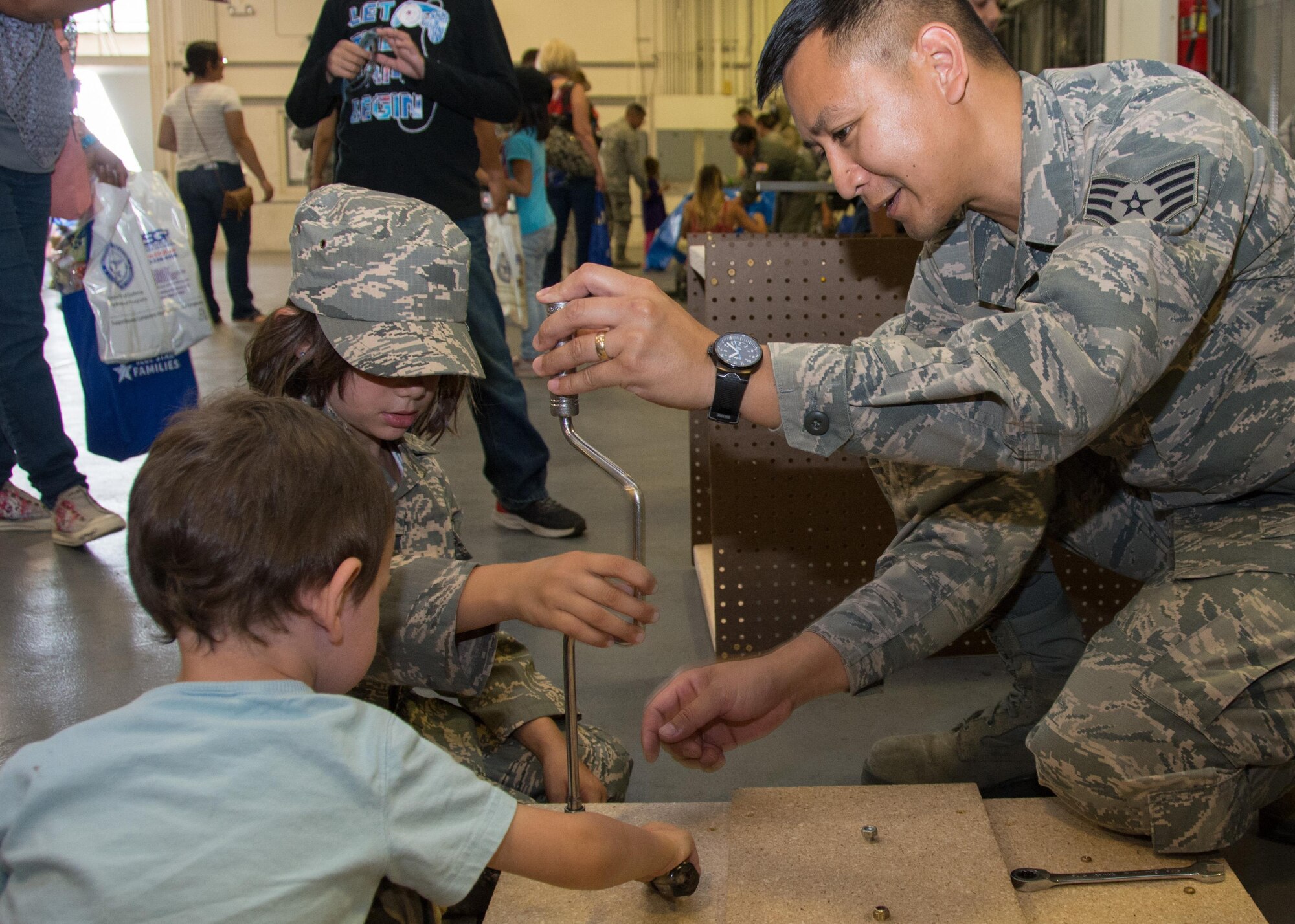 349th Air Mobility Wing Airmen and their family members participate in Operation Family Circle Aug. 12, 2017, at Travis Air Force Base, Calif.