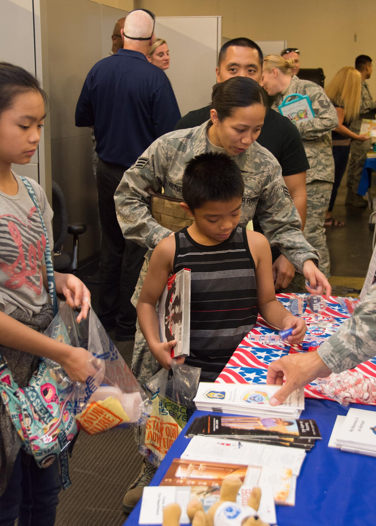 349th Air Mobility Wing Airmen and their family members participate in Operation Family Circle Aug. 12, 2017, at Travis Air Force Base, Calif.