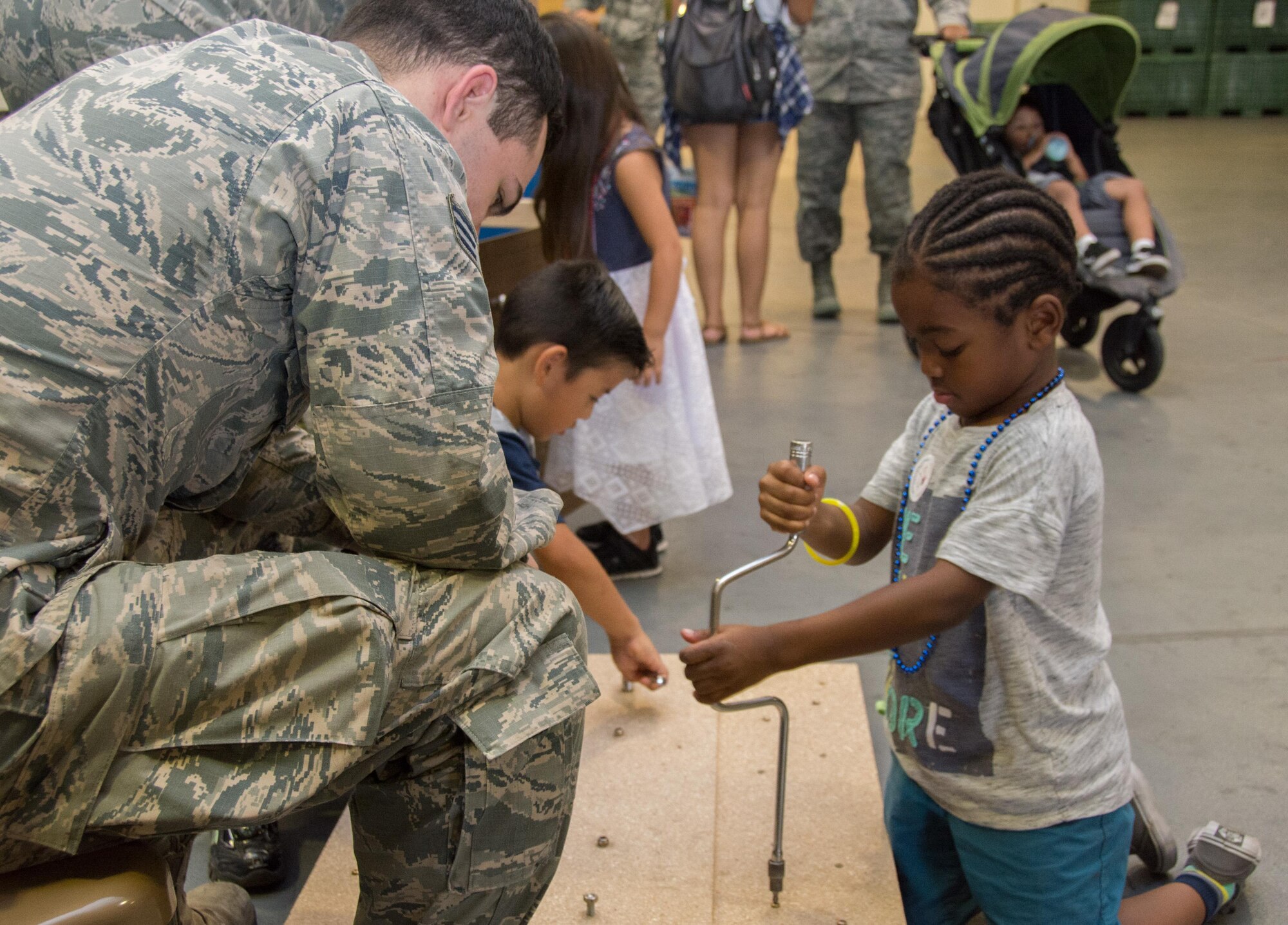 349th Air Mobility Wing Airmen and their family members participate in Operation Family Circle Aug. 12, 2017, at Travis Air Force Base, Calif.