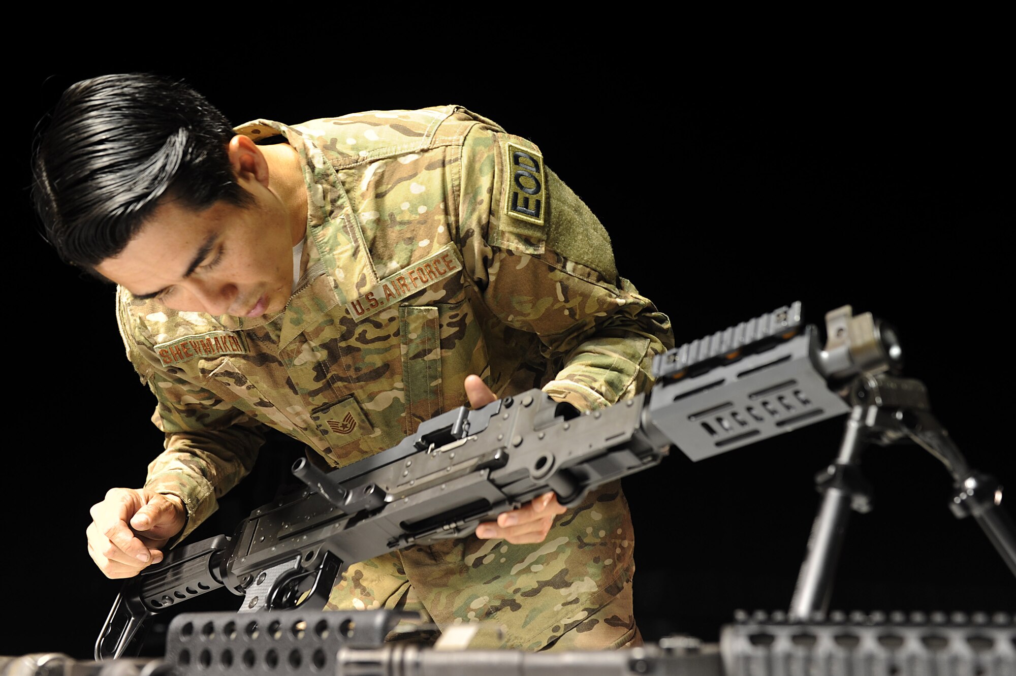 U.S. Air Force Tech. Sgt. Charles Shewmaker, 633rd Civil Engineer Squadron Explosives Ordinance Disposal team lead prepares an M240B machine gun for a weapons familiarization training during Operation Llama Fury 3.0 at Joint Base Langley-Eustis, Va., Aug. 10, 2017. During the final day of OLF 3.0., the EOD teams participated in a variety of skill and knowledge stations, where they competed for the OLF 3.0 trophy. (U.S. Air Force photo/Staff Sgt. Brittany E. N. Murphy)