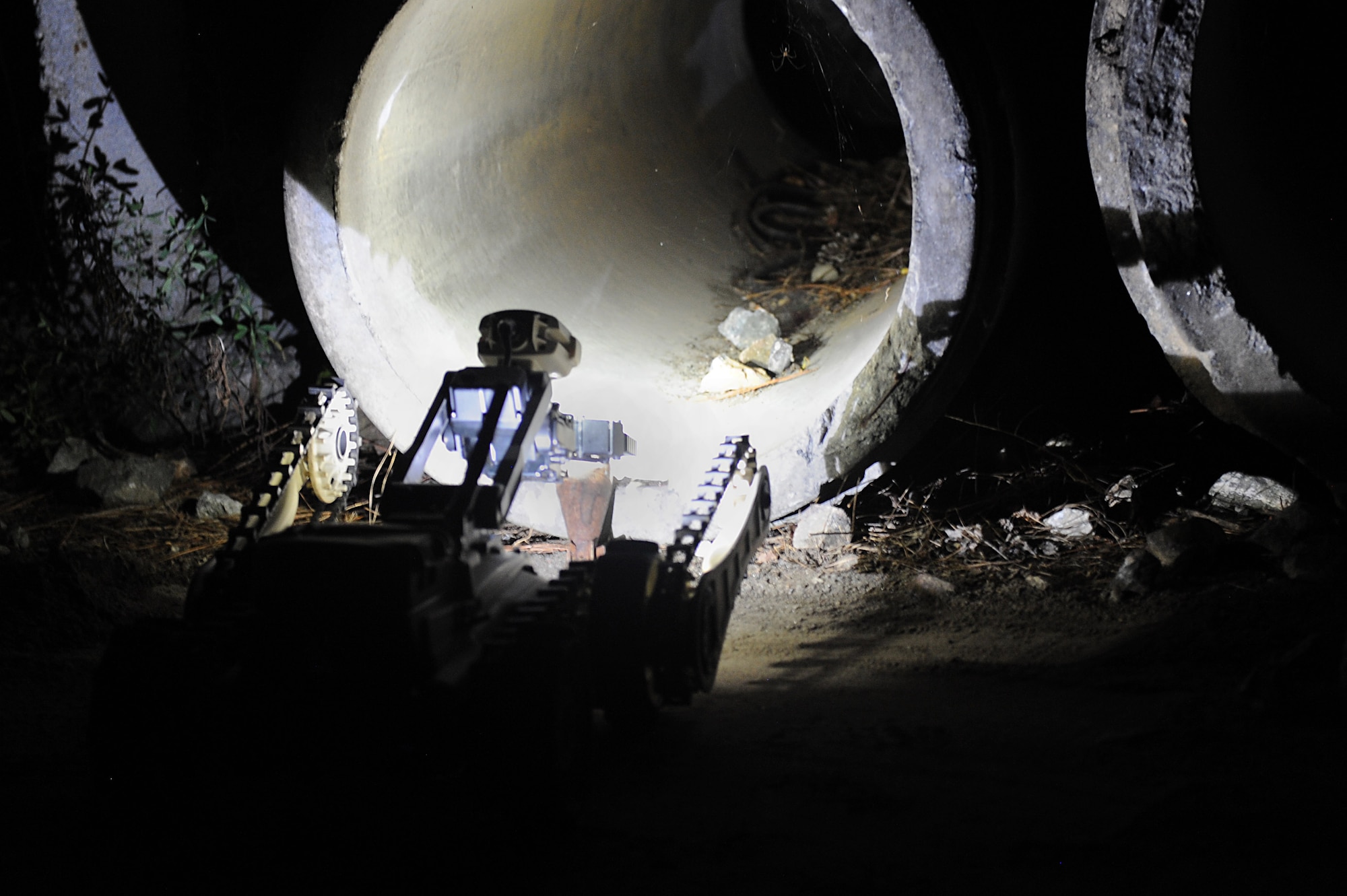 A U.S. Air Force Explosives Ordinance Disposal Airmen operates an EOD robot through an obstacle course during the final day of Operation Llama Fury 3.0 at Joint Base Langley-Eustis, Va., Aug. 10, 2017. EOD teams from seven different bases, as well as a bomb squad from Norfolk, Va., attended the five-day training to improve upon wartime readiness. (U.S. Air Force photo/Staff Sgt. Brittany E. N. Murphy)