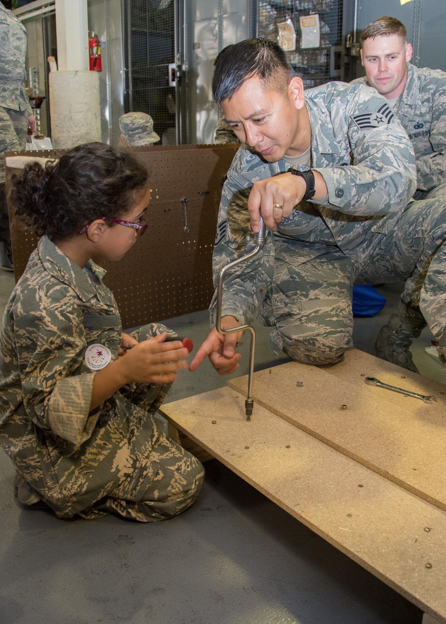 349th Air Mobility Wing Airmen and their family members participate in Operation Family Circle Aug. 12, 2017, at Travis Air Force Base, Calif.