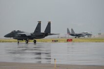 F-15 Strike Eagles from Seymour Johnson Air Force Base, North Carolina, take off from Hill AFB, Aug. 8. The F-15s flew during Combat Hammer, an evaluation exercise which tests and validates the performance of crews, pilots, and their technology while deploying precision-guided munitions. (U.S. Air Force photo by Todd Cromar)