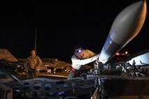 Staff Sgt. Ken Gongora, 388th Aircraft Maintenance Squadron, prepares to lift an AIM-120 advanced medium-range air-to-air missile (AMRAAM) during a Combat Archer weapons load at Hill Air Force Base, Utah, Aug. 8, 2017. The missile was fired by an F-35A Lightning II aircraft at the Utah Test and Training Range during the evaluation exercise. (U.S. Air Force photo by R. Nial Bradshaw)