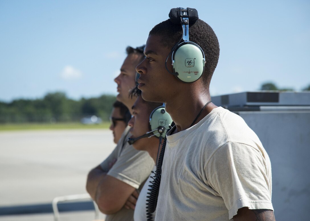 Airmen from the 71st Rescue Squadron Aircraft Maintenance Unit prepare to launch a HC-130J Combat King II, Aug. 17, 2017, at Moody Air Force Base, Ga. Maintainers perform various tasks prior to take-off such as pre-flight inspections, removing plugs and covers, repairing any problems found during crew pre-flight checks and marshalling the aircraft. (U.S. Air Force Photo by Airman 1st Class Erick Requadt)