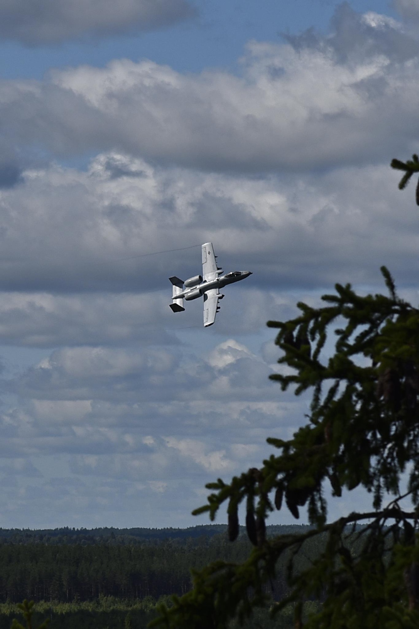 An A-10C Thunderbolt II aircraft conducts an aerial survey of the terrain Aug. 14, 2017, for a training exercise at Tapa Range, Estonia. The flying training deployment is funded by the European Reassurance Initiative in support of Operation Atlantic Resolve. The U.S. Air Force’s forward presence in Europe allows the U.S. to work with allies and partners to develop and improve ready air forces capable of maintaining regional security. (U.S. Air National Guard photo by Airman 1st Class Sarah M. McClanahan)