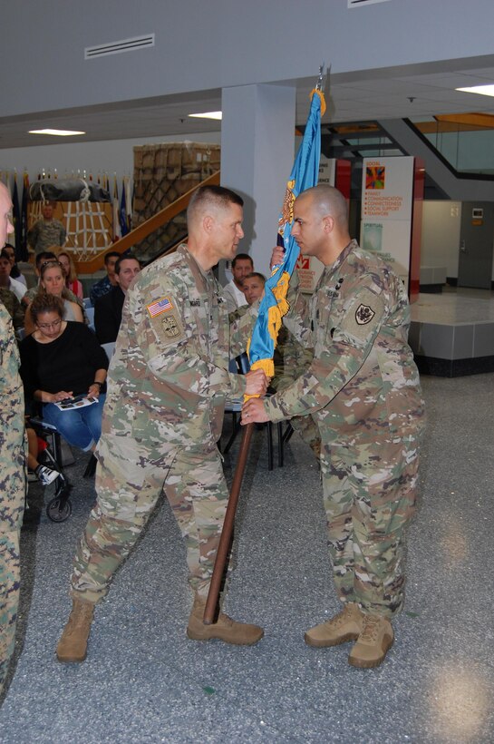 Left to Right: U.S. Army Col. Brad J. Eungard, commander of Defense Logistics Agency (DLA) Distribution Susquehanna, Pa., passes the unit colors (guidon) to U.S. Army 1st Sgt. Maximo Nunez, demonstrating the continuity of leadership and formalizing the transfer of authority as he assumes the position of DLA Distribution, Susquehanna, Pa. Installation Senior Enlisted Advisor and 1st Sgt. during a ceremony held August 15, 2017 at the DLA Distribution Center, Susquehanna, Pa.