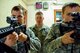 DAYTON, Ohio – Staff Sgt. Malcolm MacDougall, 88th Security Forces Squadron unit instructor (center), has Staff Sgt. Kyle Brophy (left) and Airman 1st Class Grant Prescott practice proper shouldering technique before conducting a walkthrough
of clearing procedures during annual training July 12. A former Marine Corps facility here provides a more realistic active shooter response training environment than one used previously, according to MacDougall. (U.S. Air Force photo/John Harrington)