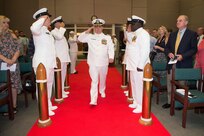 Capt. Gustavo Vergara center pictured arrives for his change of command ceremony.