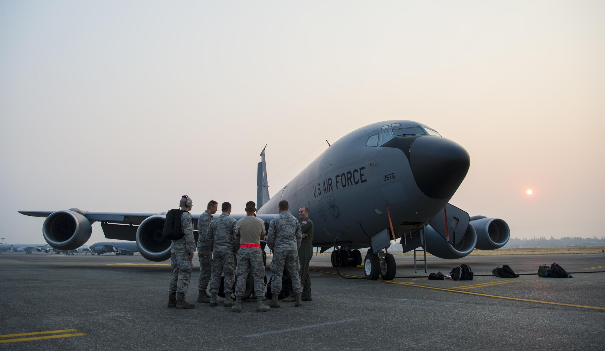 Airmen in front of an aircraft