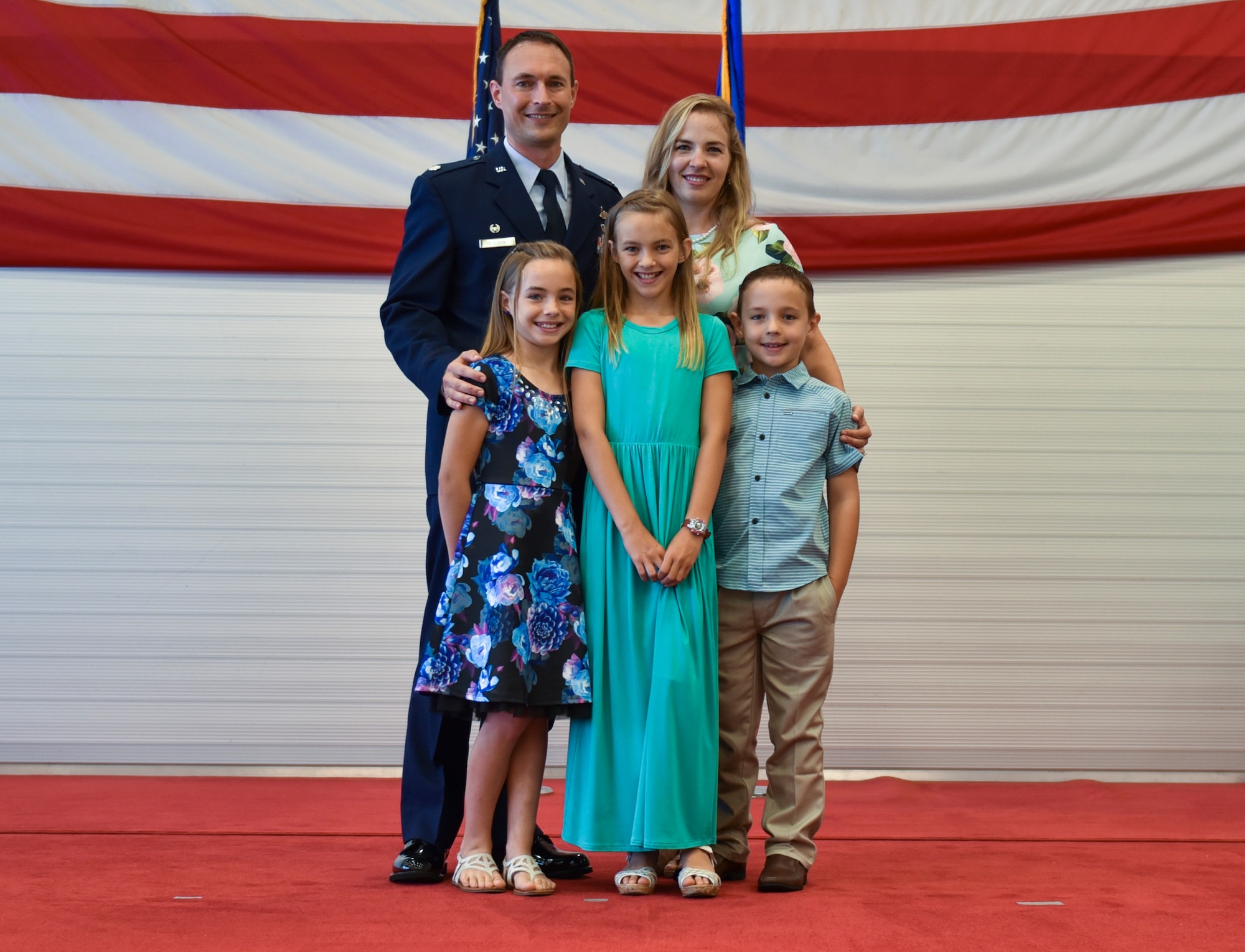 U.S. Air Force Lt. Col. Tyler Ellison, 325th Operations Support Squadron commander, stands with his family during his change of command ceremony at Tyndall Air Force Base, Fla., June 20, 2017.