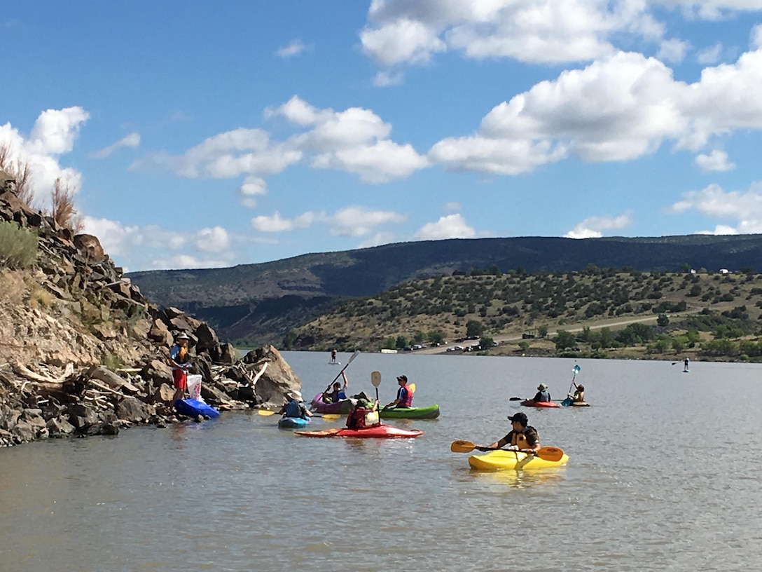 COCHITI LAKE, N.M. – Volunteers in personal watercraft travel the lake to pick up debris during the “Cochiti Sweep” event, Aug. 12, 2017.