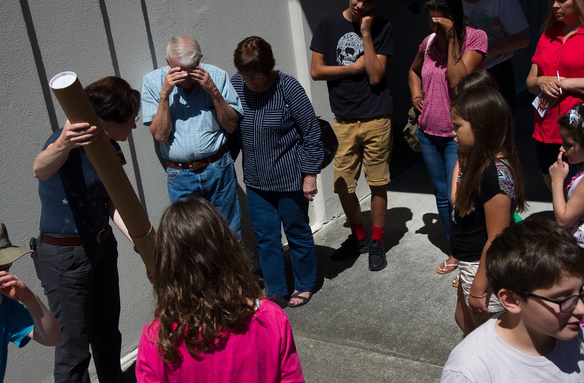 Master Sgt. Regina Rector, occupational safety manager with the 446th AW demonstrates how to use a cardboard tube modified to observe a solar eclipse. Rector, an amateur astronomer and a reserve citizen airman, gave a class at the McChord Library on Joint Base Lewis-McChord in preparation of the total solar eclipse on August 21, 2017.