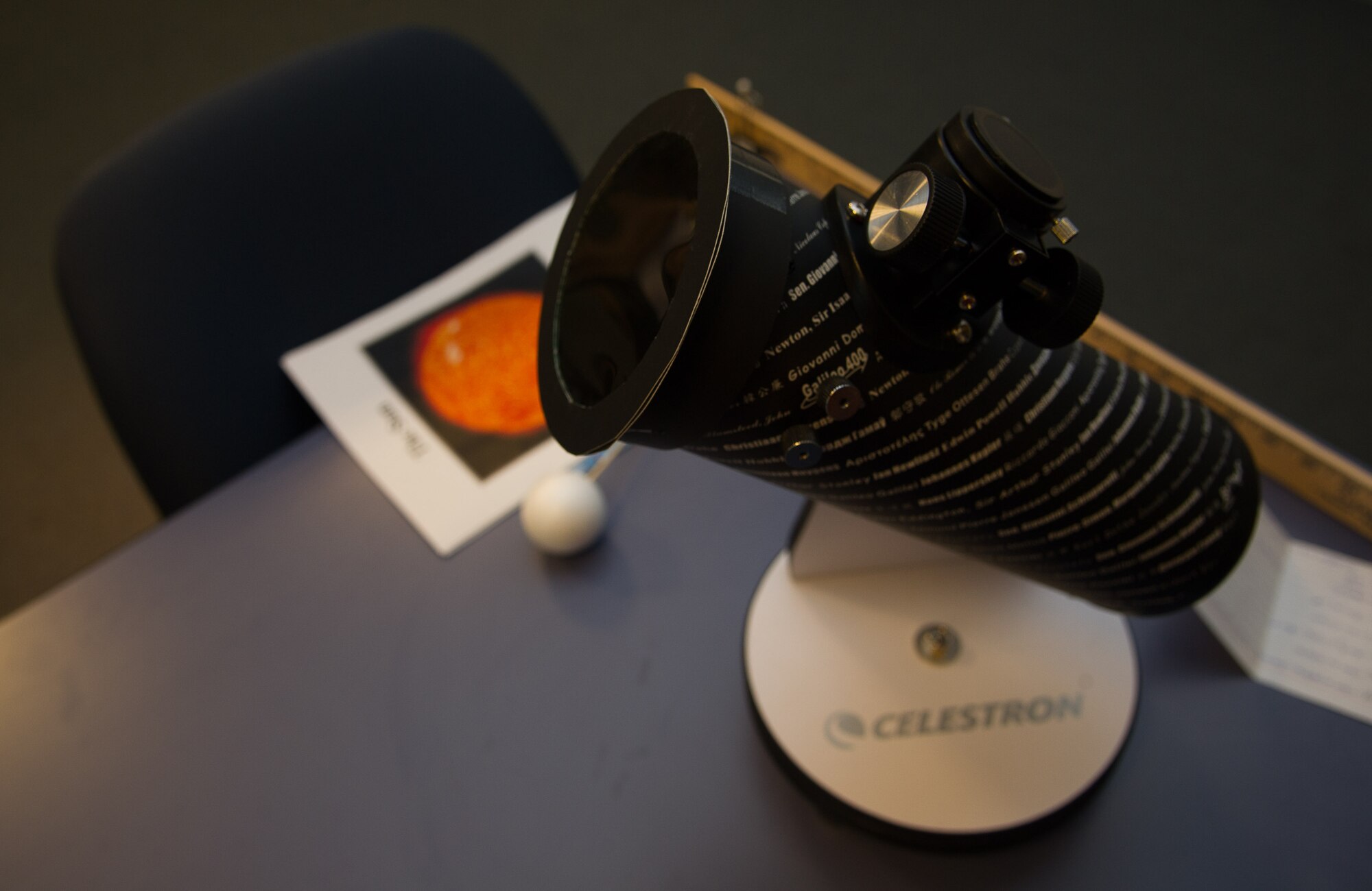 A telescope affixed with a solar filter sits on a table in the McChord Library. MSgt. Regina Rector, occupational safety manager with the 446th AW gave a lecture to members of Joint Base Lewis-McChord about the total solar eclipse occurring on August 21, 2017. (U.S. Air Force photo by David L. Yost)