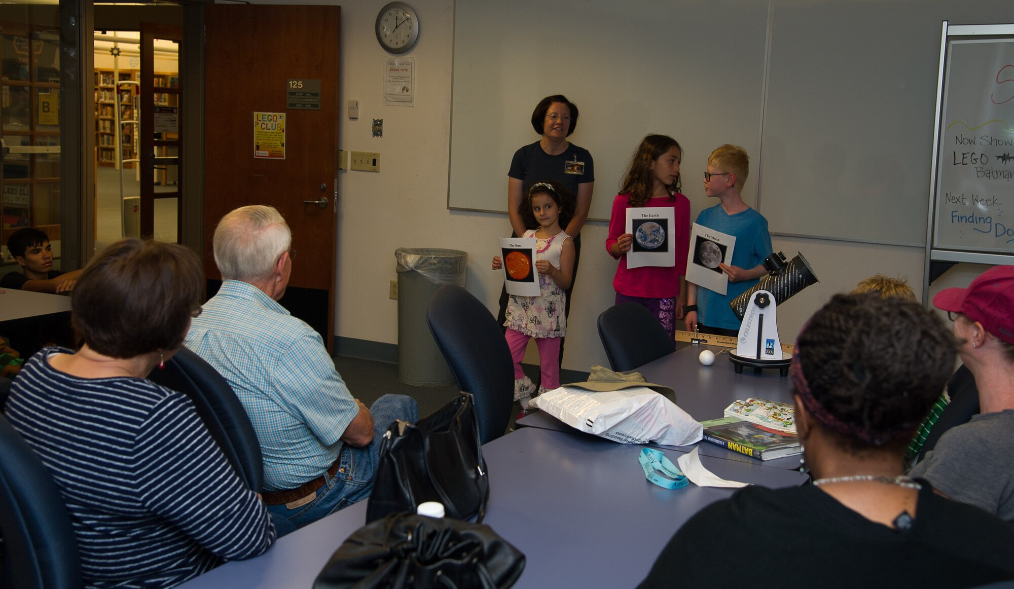 Master Sgt. Regina Rector, occupational safety manager with the 446th AW gives a class to an audience of astronomy enthusiasts at the McChord Library on Joint Base Lewis-McChord. The class is meant to prepare people to observe the total solar eclipse on August 21, 2017. (U.S. Air Force photo by David L. Yost)