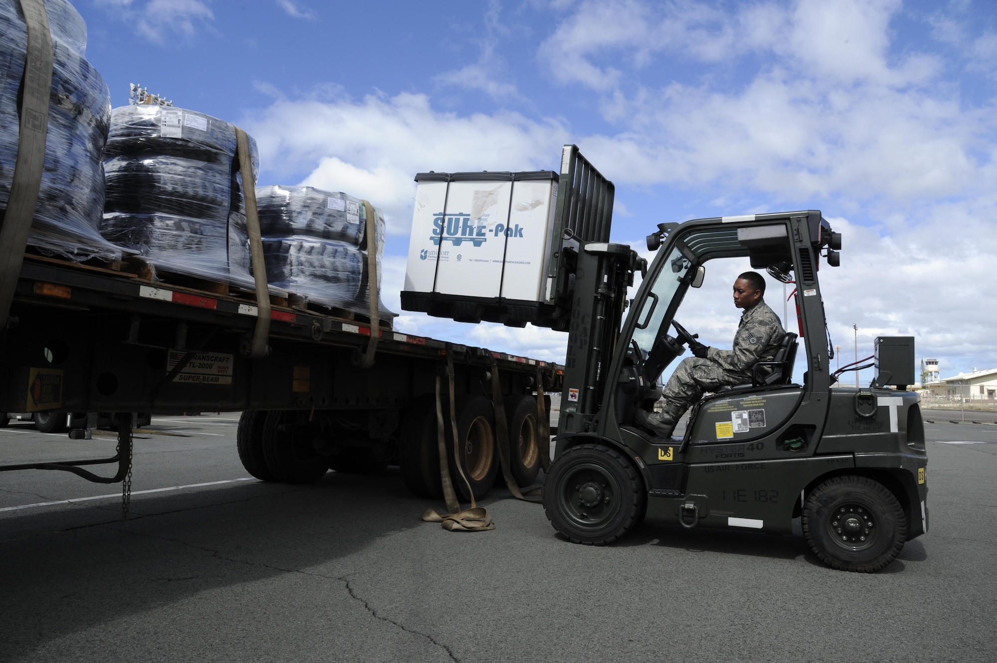 U.S. Air Force Staff Sgt. Adrian Faustino, air transportation specialist for the Air Force Reserve’s 48th Aerial Port Squadron, moves cargo using a 4k forklift at Joint Base Pearl Harbor-Hickam, Hawaii, Aug. 17, 2017. The 48th APS provides expertise in all areas of air terminal operations to include aircraft loading, cargo processing and inspecting, passenger services, aircraft fleet services and aerial port command and control.