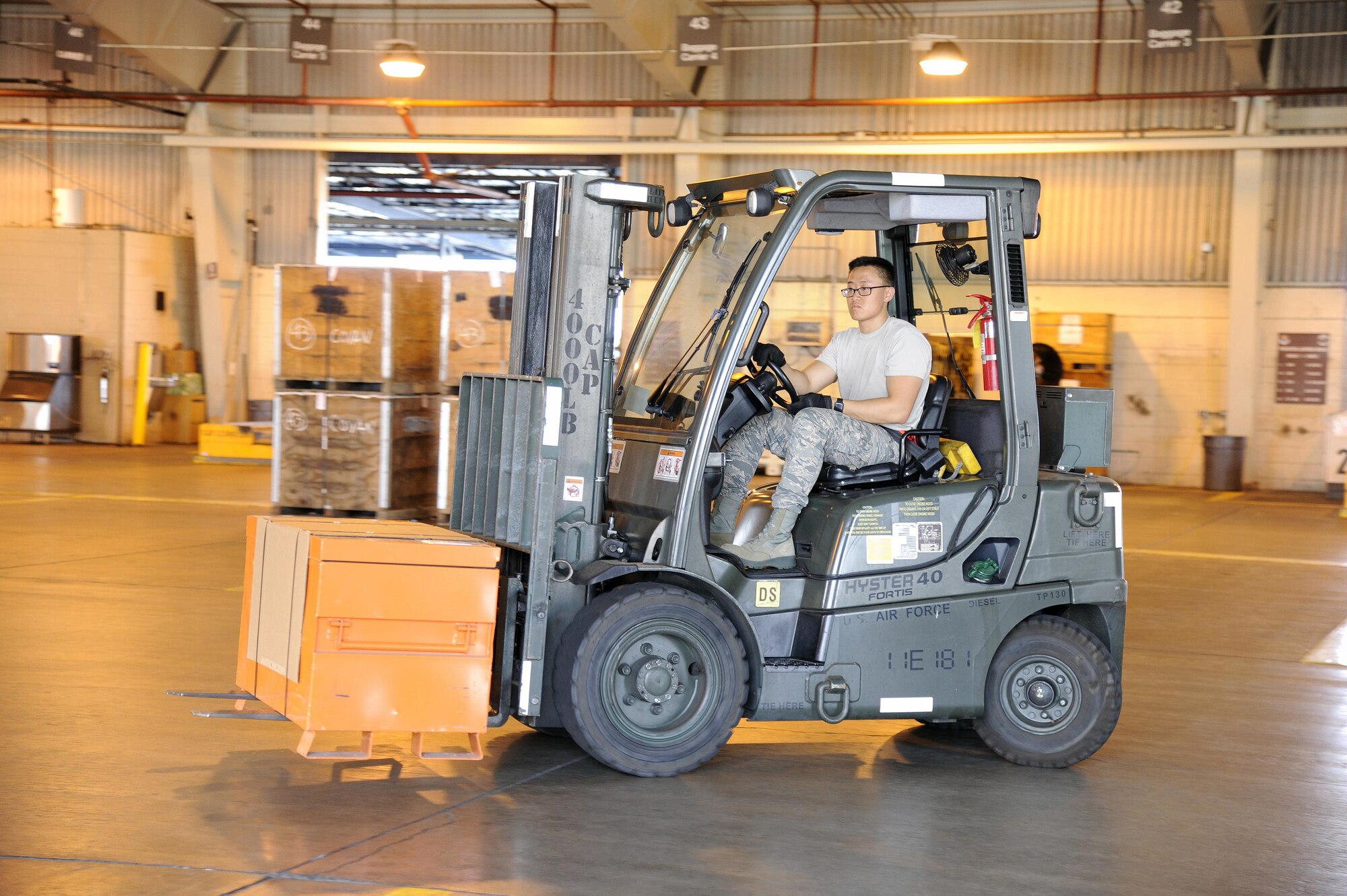 U.S. Air Force Airman Christopher Lee, an air transportation specialist for the Air Force Reserve’s 48th Aerial Port Squadron, moves cargo using a 4k forklift at Joint Base Pearl Harbor-Hickam, Hawaii, Aug. 17, 2017. The 48th APS provides expertise in all areas of air terminal operations to include aircraft loading, cargo processing and inspecting, passenger services, aircraft fleet services and aerial port command and control.