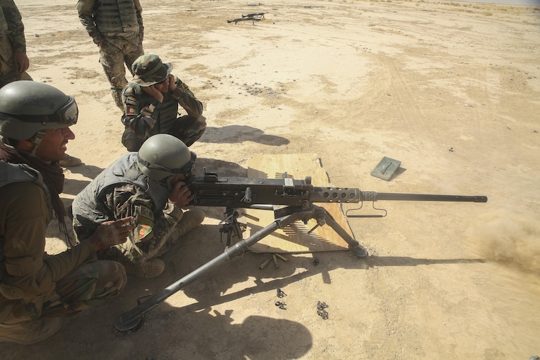 An Afghan National Army soldier with the Helmand Regional Military Training Center fires a M2 Browning .50 Machine Gun during a training range at Camp Shorabak, Afghanistan, Aug. 17, 2017. More than 60 RMTC instructors are partnering with U.S. Marine advisors assigned to Task Force Southwest throughout a four-week train-the-trainer course to build upon their infantry knowledge and teaching skills. The RMTC is scheduled to begin an eight-week operational readiness cycle with 6th Brigade, 1st Kandak, 215th Corps in September. (U.S. Marine Corps photo by Sgt. Lucas Hopkins)