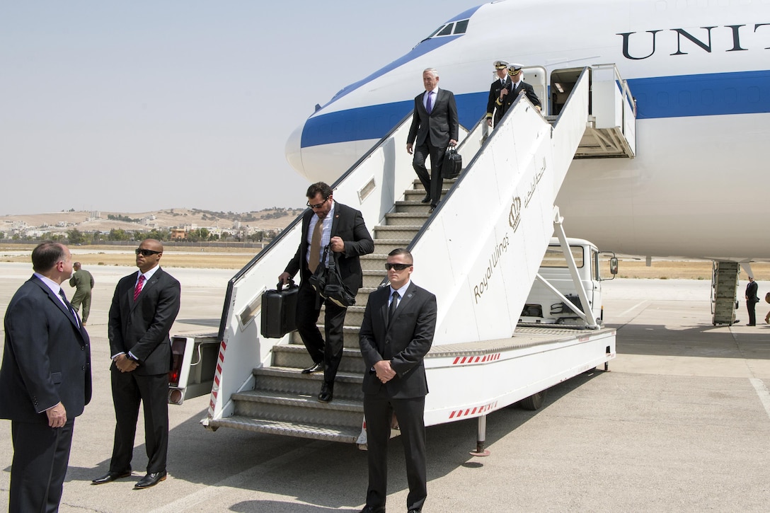 Defense Secretary Jim Mattis disembarking form an airplane.