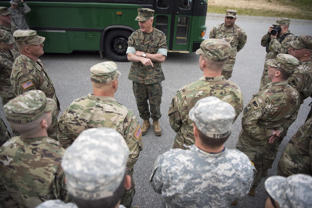 A military leader talks to soldiers in Alaska.