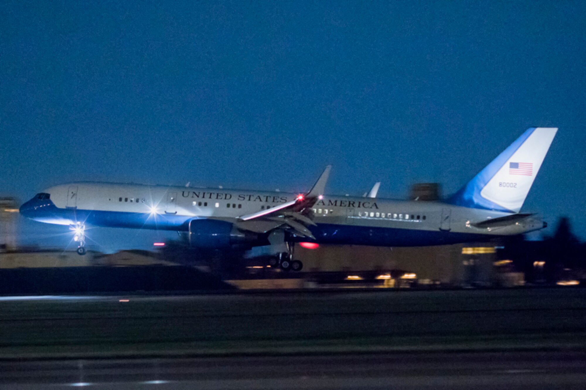 A C-32 aircraft lands at Yokota AB