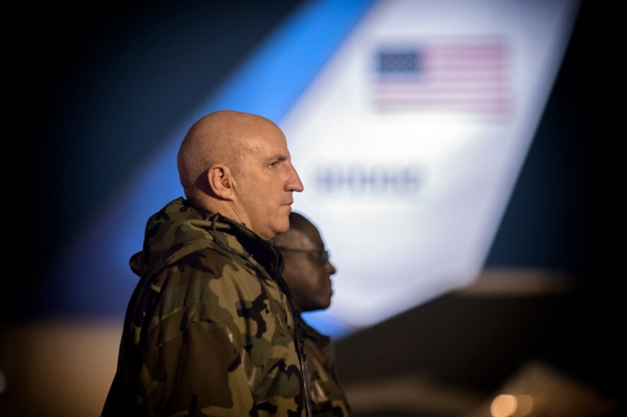 Col. Moss and CMSgt Young stand at attention