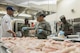 U.S. Air Force Airman 1st Class Tylacia Berard, a 35th Force Support Squadron food service journeyman, seasons chicken at the Grissom Dining Facility at Misawa Air Base, Japan, Aug. 15, 2017. Food service Airmen usually serve roughly 300 people per day. With the recent increase in personnel due to exercise Northern Viper 17, their numbers have shot up to nearly 800 daily. This means more food to whip up and serve at each meal. Misawa Airmen are currently exercising as a power projection hub with additional services being offered to accommodate more personnel. (U.S. Air Force photo by Senior Airman Jarrod Vickers)