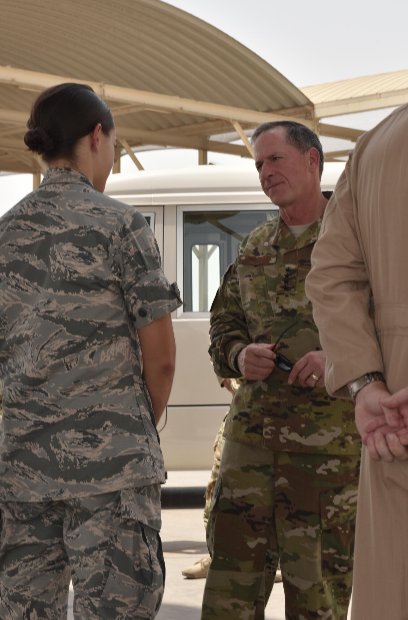 Lt. Erin Shelhorse, officer in charge of the 27th Expeditionary Aircraft Maintenance Unit, speaks with Air Force Chief of Staff Gen. David L. Goldfein at Al Dhafra Air Base, United Arab Emirates, Aug. 18, 2017.